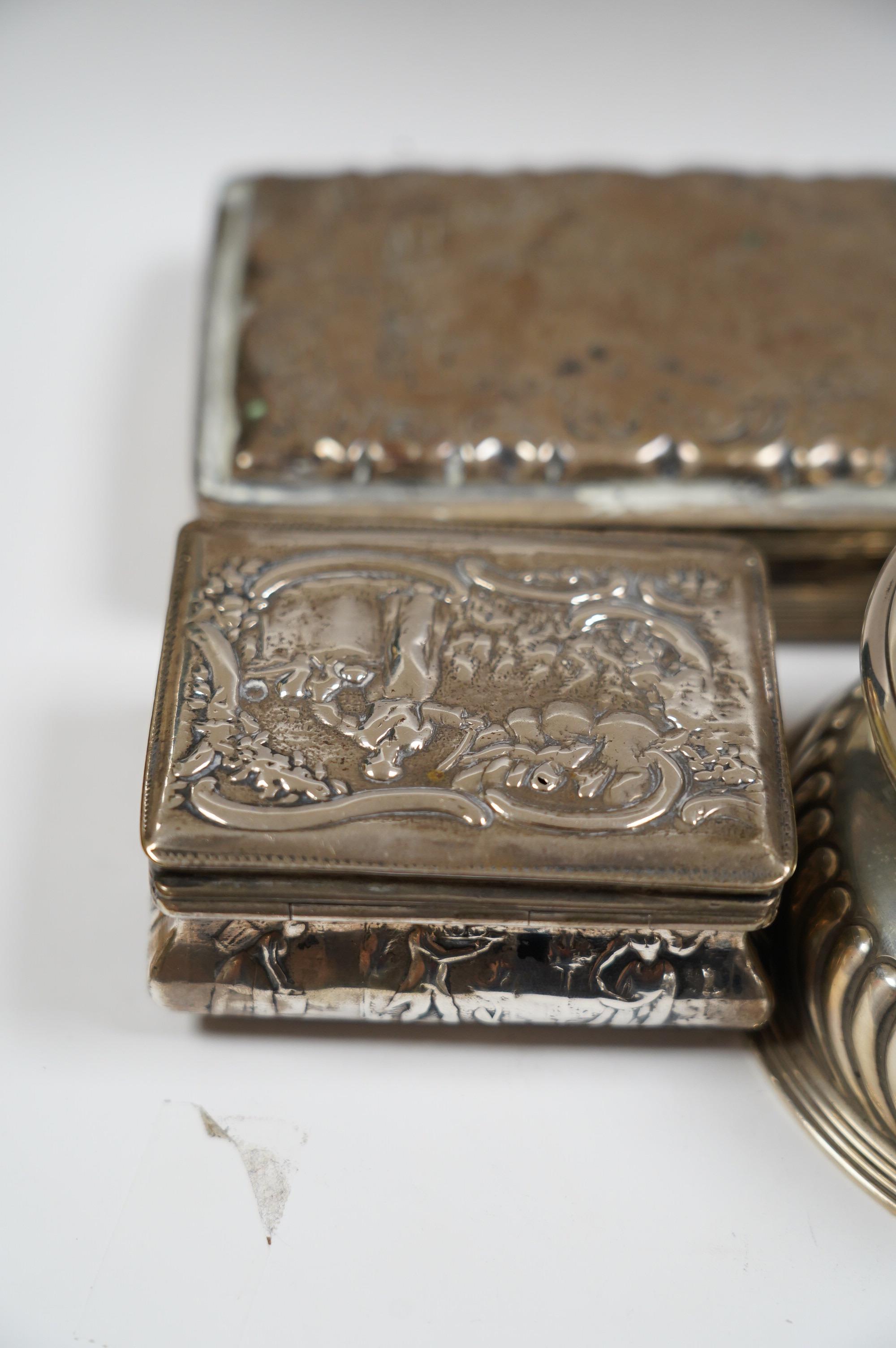 A late Victorian demi-fluted silver circular inkwell, with later engraved inscription, Birmingham, 1891, base diameter 11.4cm and two continental white metal boxes. Condition - poor to fair